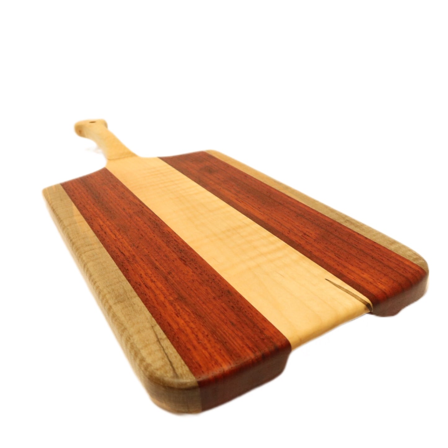 "Padauk and curly maple charcuterie board with raised handle. The board features a unique combination of warm reddish-brown padauk and light-colored curly maple, with a raised handle for easy carrying. Perfect for serving cheeses, meats, bread, crackers, fruit, and more. A stunning display piece that is sure to impress your guests."