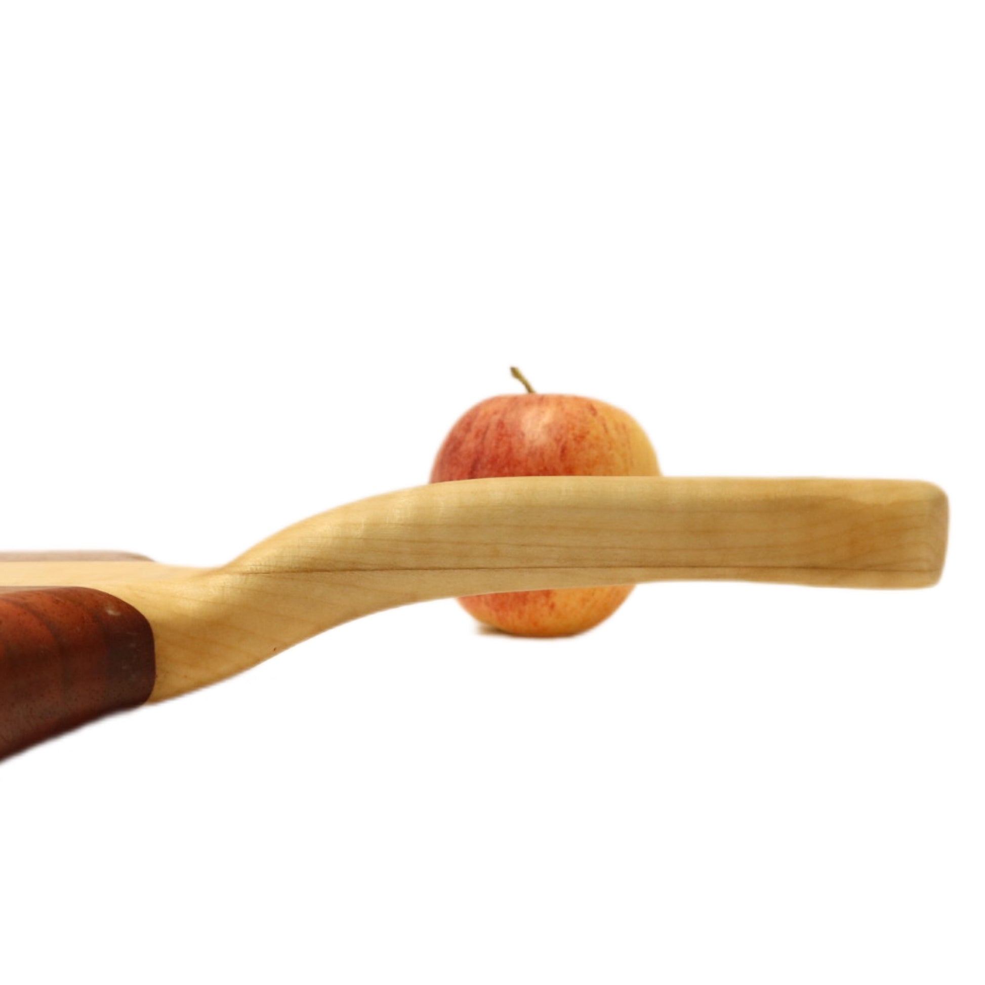 "Padauk and curly maple charcuterie board with raised handle. The board features a unique combination of warm reddish-brown padauk and light-colored curly maple, with a raised handle for easy carrying. Perfect for serving cheeses, meats, bread, crackers, fruit, and more. A stunning display piece that is sure to impress your guests."